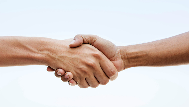 Shaking hands closing a deal