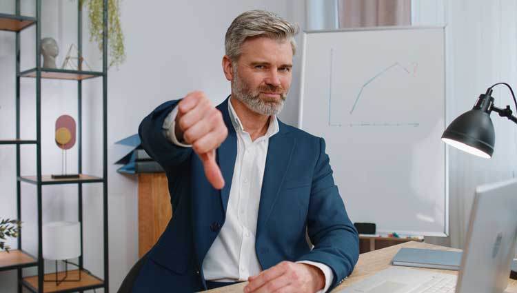 An image of man giving a thumbs down showing What Will You Do When Your Boss Rejects Your Ideas?