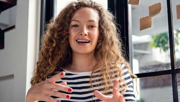 An image of a woman showing When an Interviewer Asks You to Describe Yourself.