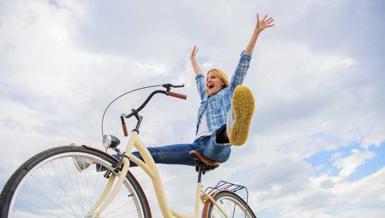 An image of a woman who will enjoy greater success of riding her bike.