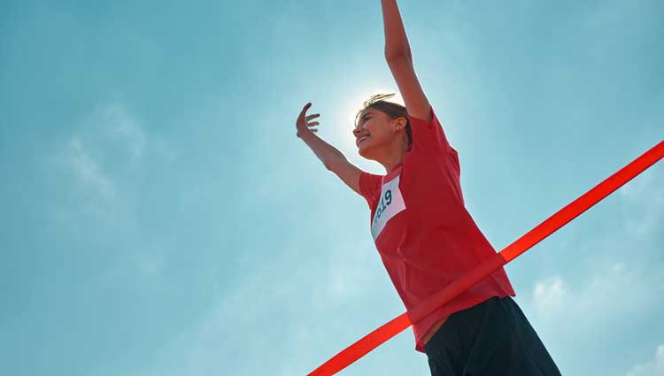 An image of a woman in a race shoeing to finish what you started.