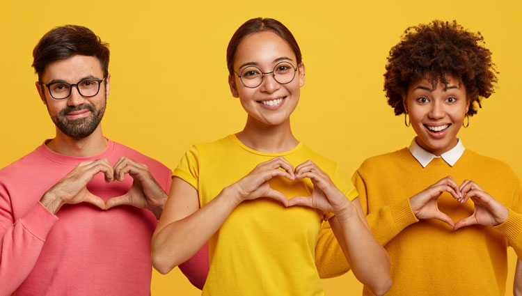 Three people show love heart shape