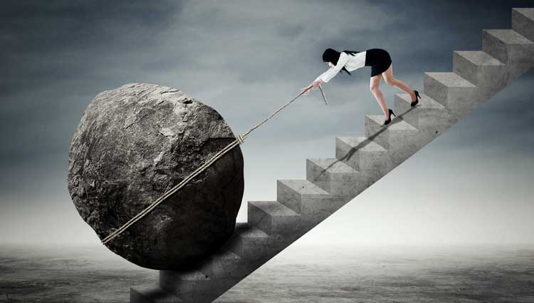 An image of a lady struggling to be productive and accomplish her task.