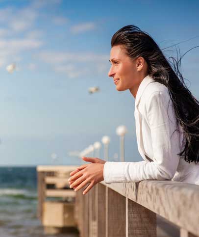 Successful Businesswoman Dreaming on the Beach